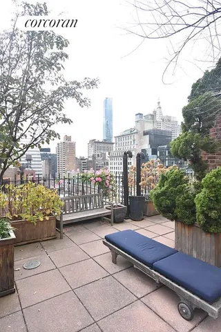 a bench sitting in front of a building