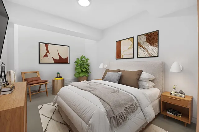 a bedroom with a bed and a desk