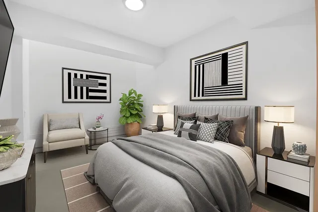 a bedroom with a bed and a couch