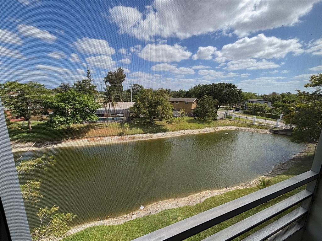 4310 Northwest 12th Court, Unit 308 Lauderhill, FL 33313 - Photo 11 of 24 a view of a lake from a balcony