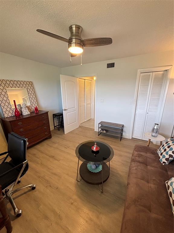 4310 Northwest 12th Court, Unit 308 Lauderhill, FL 33313 - Photo 14 of 24 a living room with furniture and a table