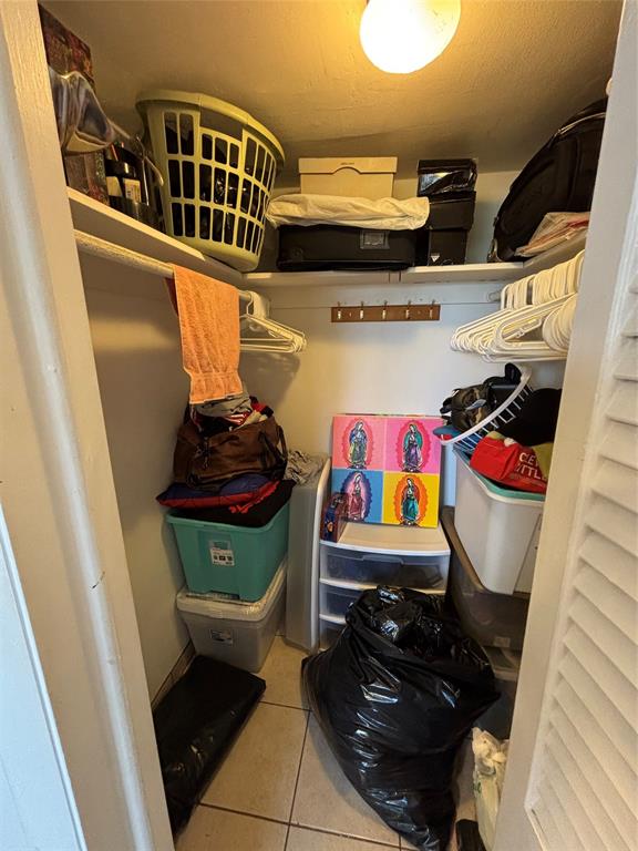 4310 Northwest 12th Court, Unit 308 Lauderhill, FL 33313 - Photo 15 of 24 a utility room with lots of clutter and cabinets