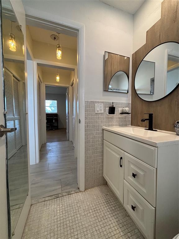 4310 Northwest 12th Court, Unit 308 Lauderhill, FL 33313 - Photo 17 of 24 a bathroom with a double vanity sink mirror and shower