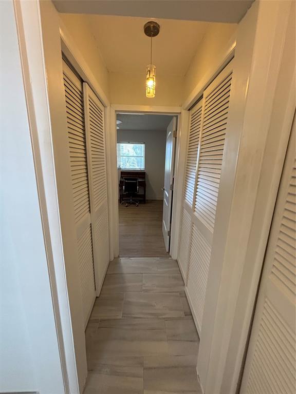 4310 Northwest 12th Court, Unit 308 Lauderhill, FL 33313 - Photo 18 of 24 a view of a hallway with wooden floor and staircase