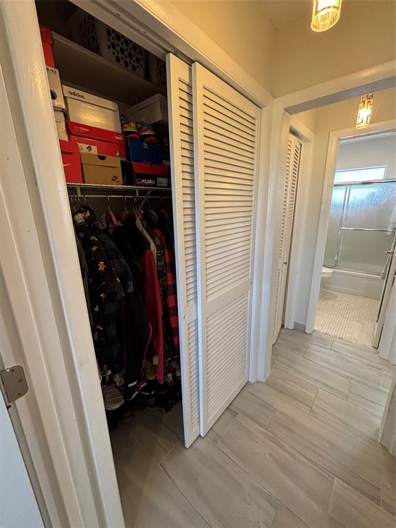 4310 Northwest 12th Court, Unit 308 Lauderhill, FL 33313 - Photo 19 of 24 a view of walk in closet with clothes and shoes