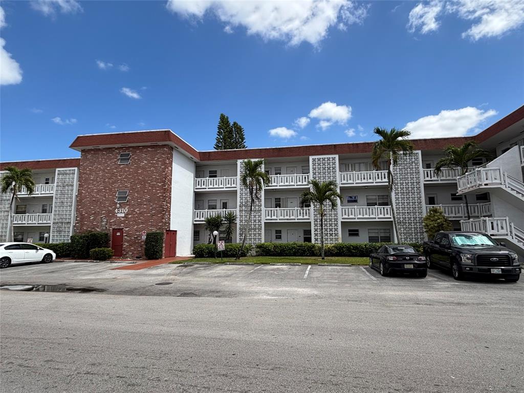 4310 Northwest 12th Court, Unit 308 Lauderhill, FL 33313 - Photo 22 of 24 a view of a building with a street