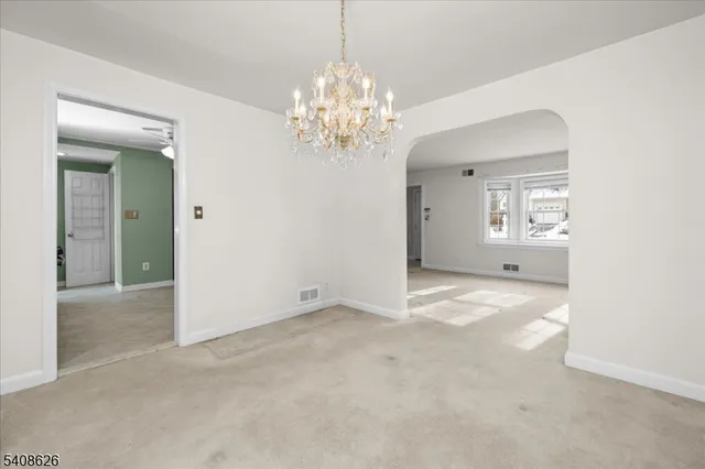 a kitchen with stainless steel appliances granite countertop a stove and a refrigerator