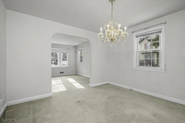 a kitchen with stainless steel appliances granite countertop a sink and a window