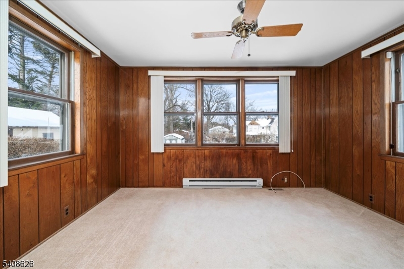 112 Union Street Cedar Grove, NJ 07009 - Photo 16 of 43 a view of a livingroom with a ceiling fan and window