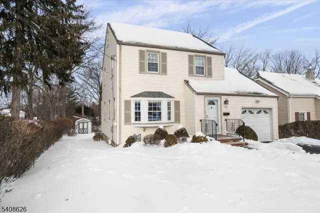 a view of a covered with snow in front of house
