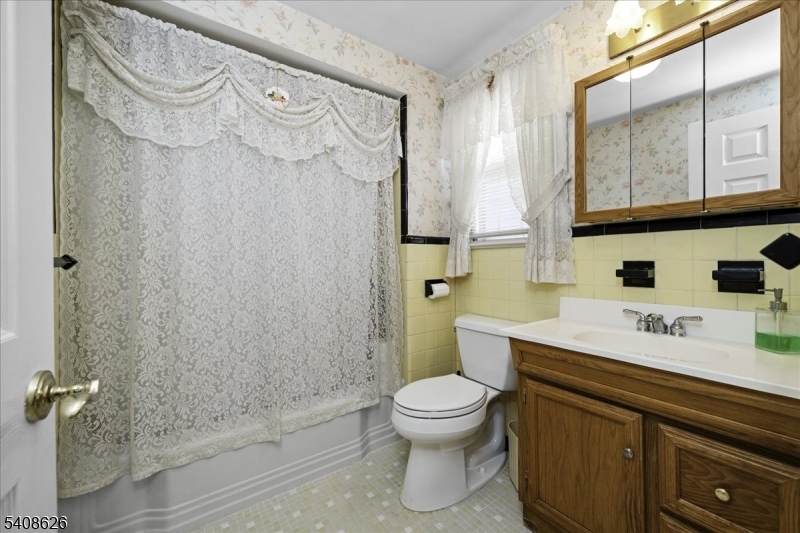 112 Union Street Cedar Grove, NJ 07009 - Photo 25 of 43 a bathroom with a sink a toilet and shower