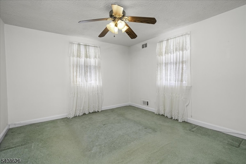 112 Union Street Cedar Grove, NJ 07009 - Photo 26 of 43 a view of an empty room with a window