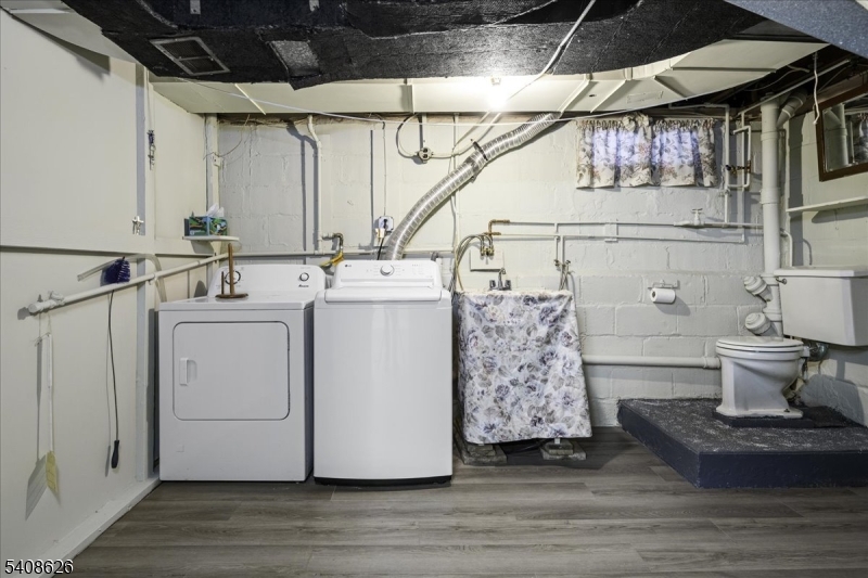 112 Union Street Cedar Grove, NJ 07009 - Photo 37 of 43 a utility room with dryer and washer