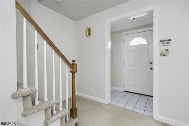 an empty room with windows and closet area