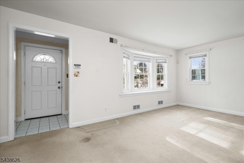 112 Union Street Cedar Grove, NJ 07009 - Photo 5 of 43 an empty room with windows and closet area