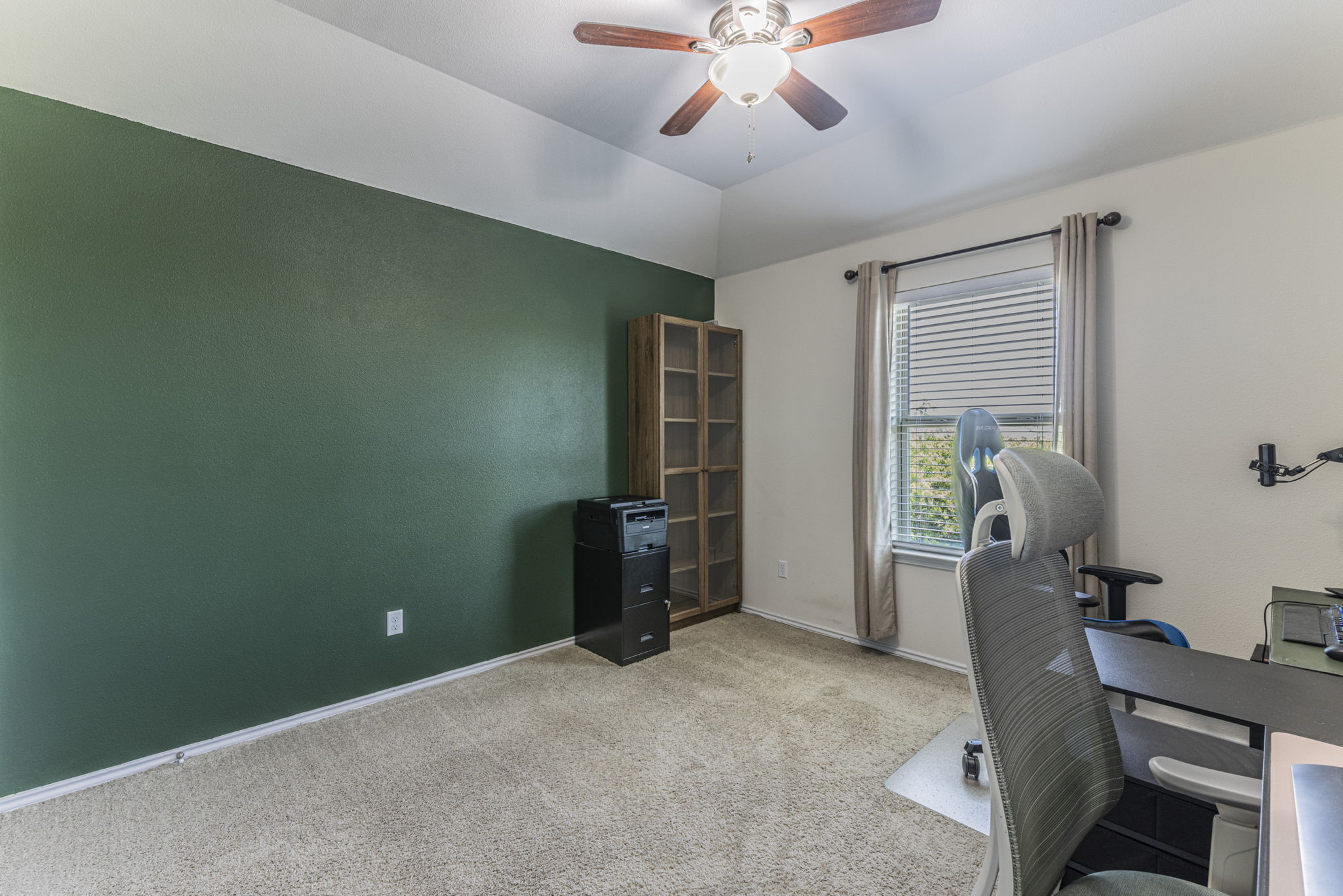 20205 Navarre Terrace Pflugerville, TX 78660 - Photo 17 of 24 a view of a workspace with furniture and a window