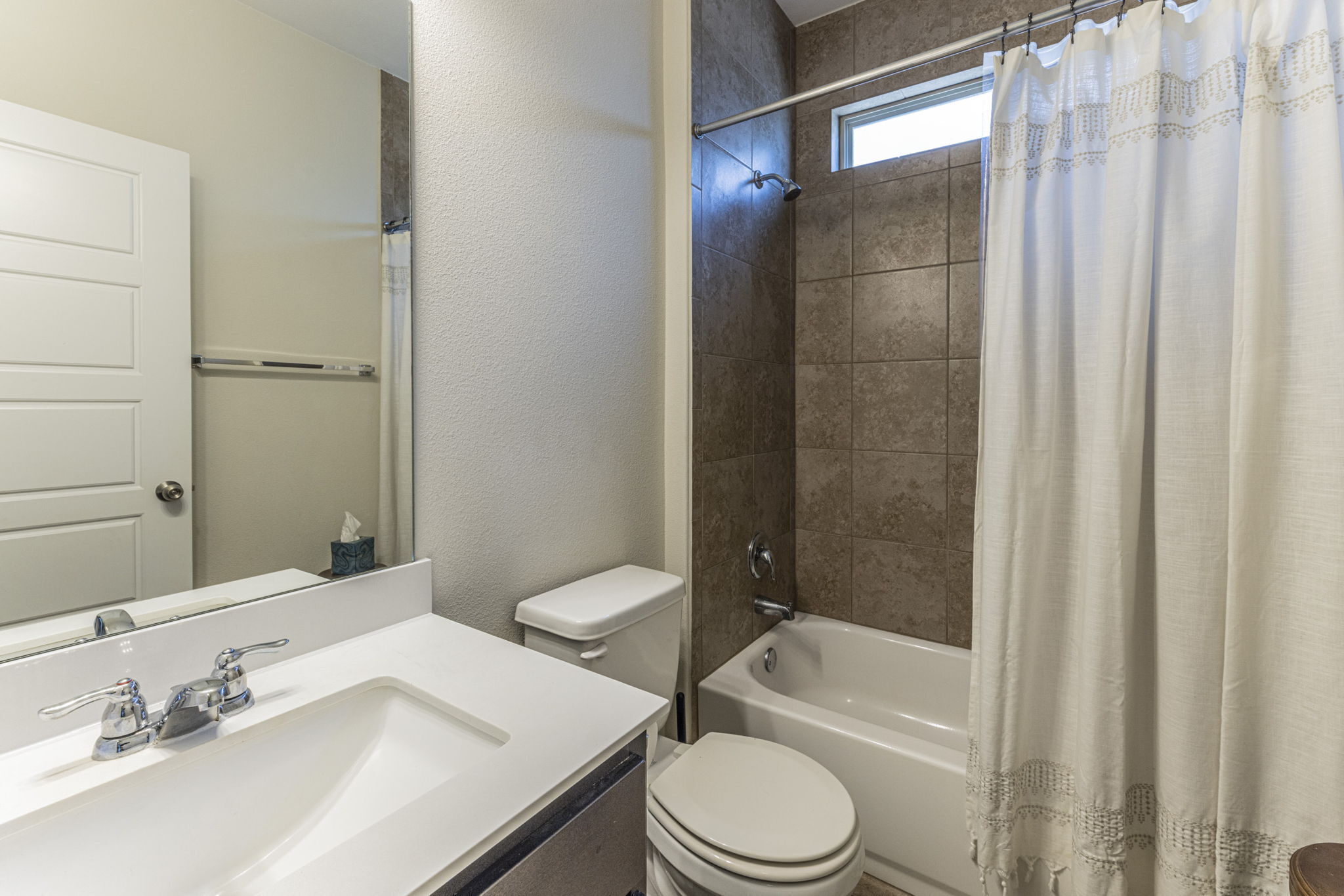 20205 Navarre Terrace Pflugerville, TX 78660 - Photo 20 of 24 a bathroom with a sink a toilet and shower