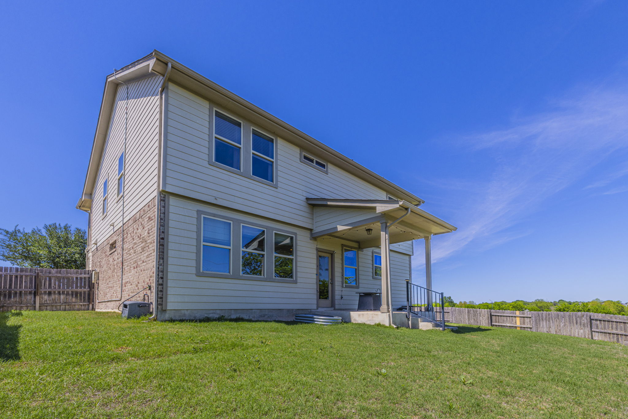 20205 Navarre Terrace Pflugerville, TX 78660 - Photo 23 of 24 a front view of a house with a yard