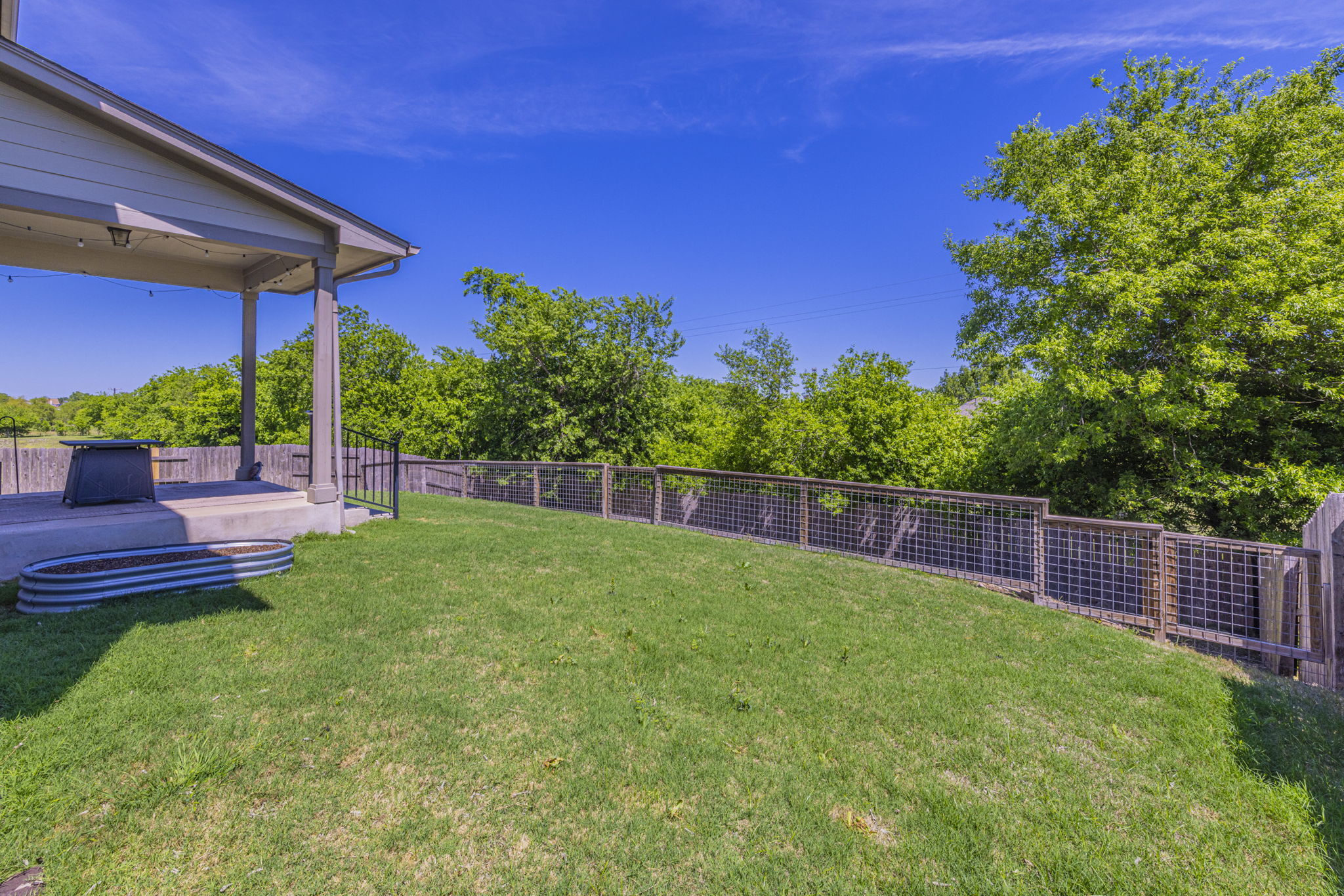 20205 Navarre Terrace Pflugerville, TX 78660 - Photo 24 of 24 a view of a backyard with a garden
