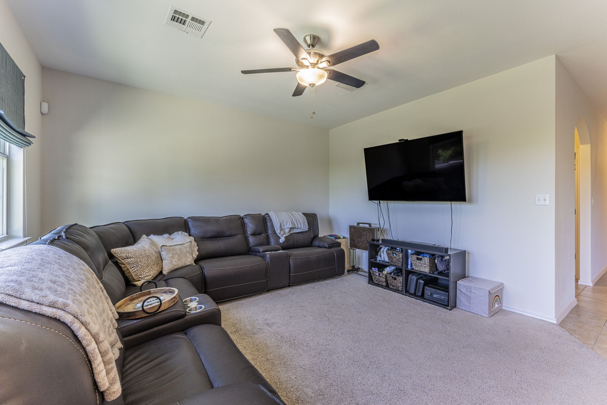 20205 Navarre Terrace Pflugerville, TX 78660 - Photo 4 of 24 a living room with furniture and a flat screen tv
