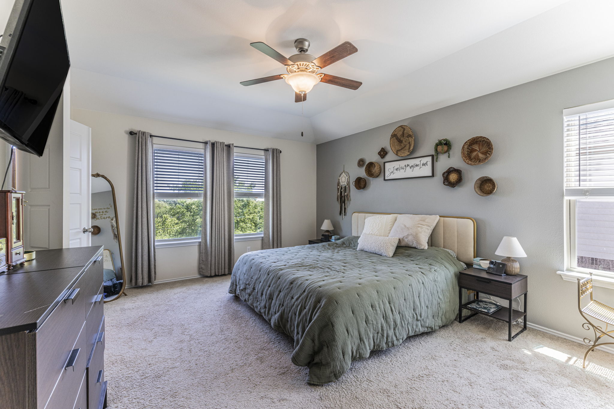 20205 Navarre Terrace Pflugerville, TX 78660 - Photo 10 of 24 a bedroom with a large bed and a large window