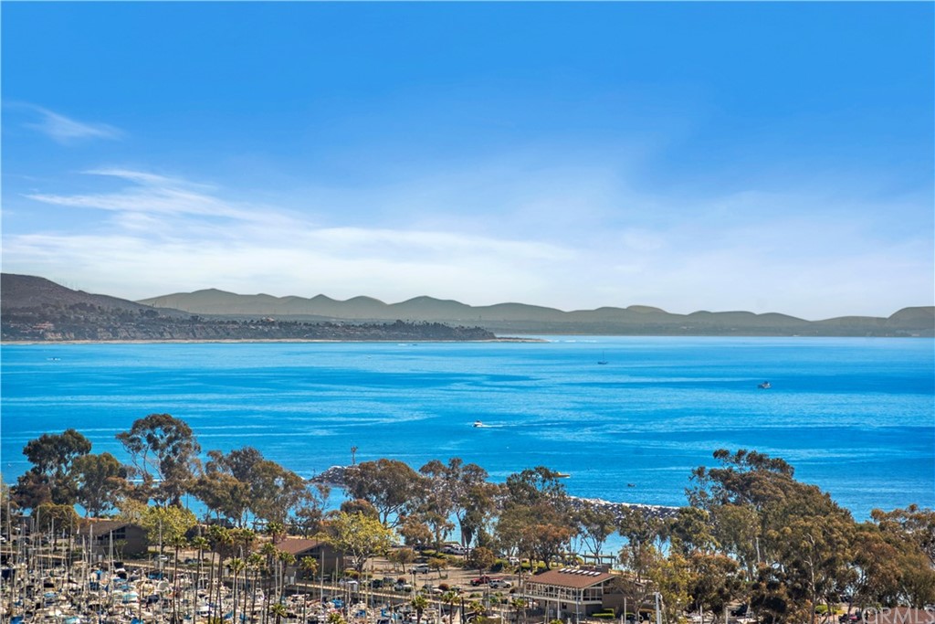 24242 Santa Clara Avenue, Unit 32 Dana Point, CA 92629 - Photo 1 of 1 a view of an ocean and a mountain