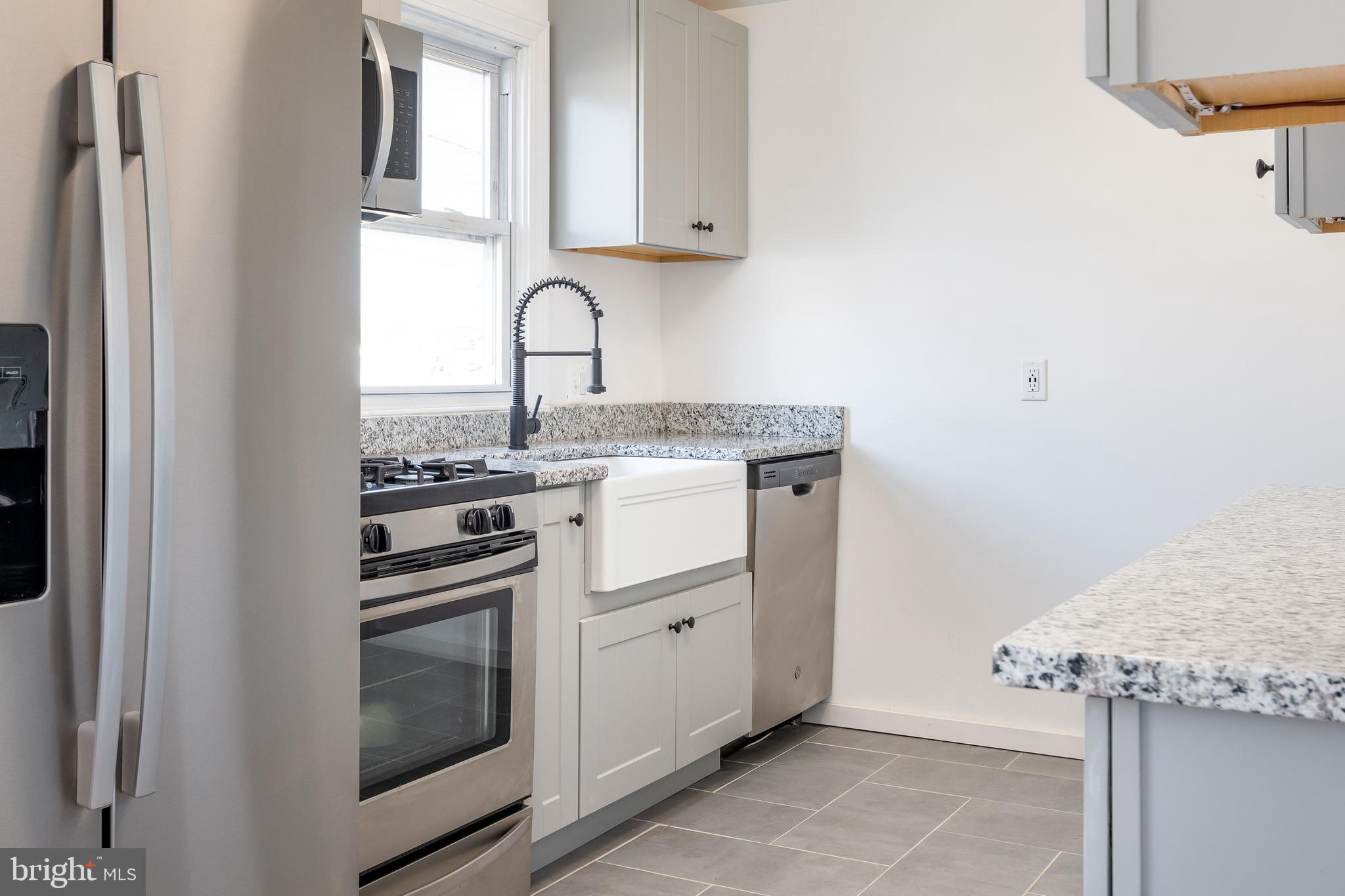 3005 Sollers Point Road Baltimore, MD 21222 - Photo 16 of 33 a kitchen with stainless steel appliances granite countertop a sink and a stove