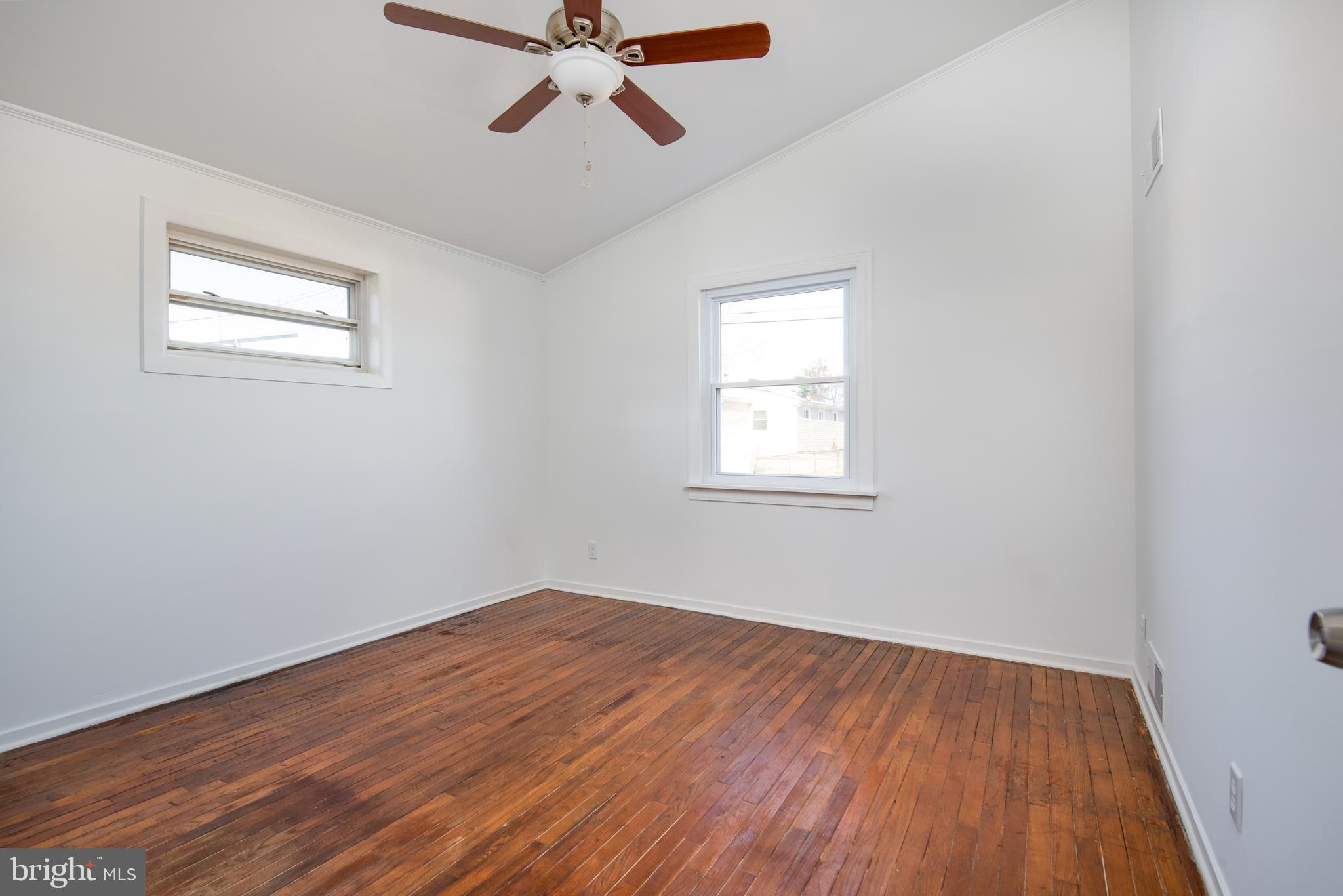 3005 Sollers Point Road Baltimore, MD 21222 - Photo 21 of 33 a view of a room with wooden floor and fan