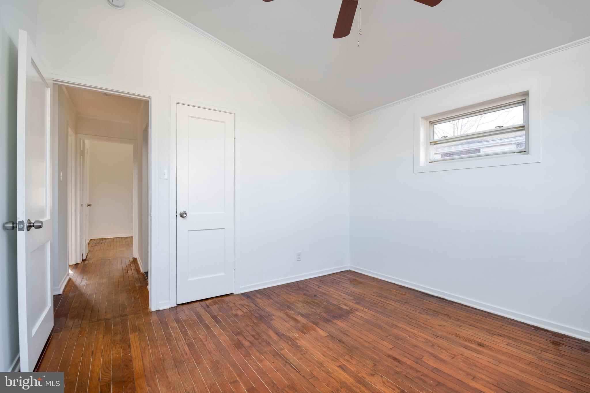 3005 Sollers Point Road Baltimore, MD 21222 - Photo 22 of 33 wooden floor in an empty room