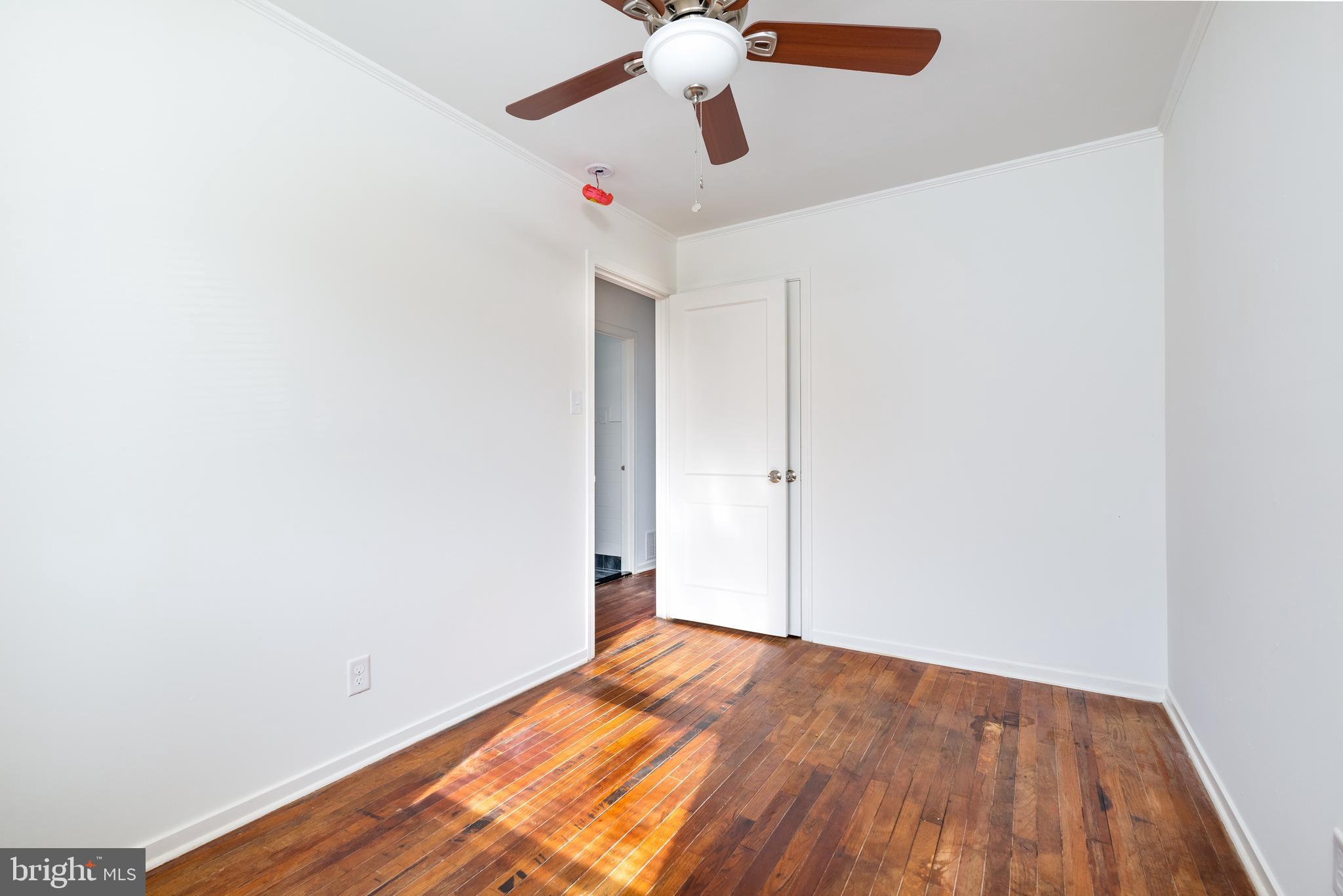 3005 Sollers Point Road Baltimore, MD 21222 - Photo 25 of 33 a view of empty room with wooden floor