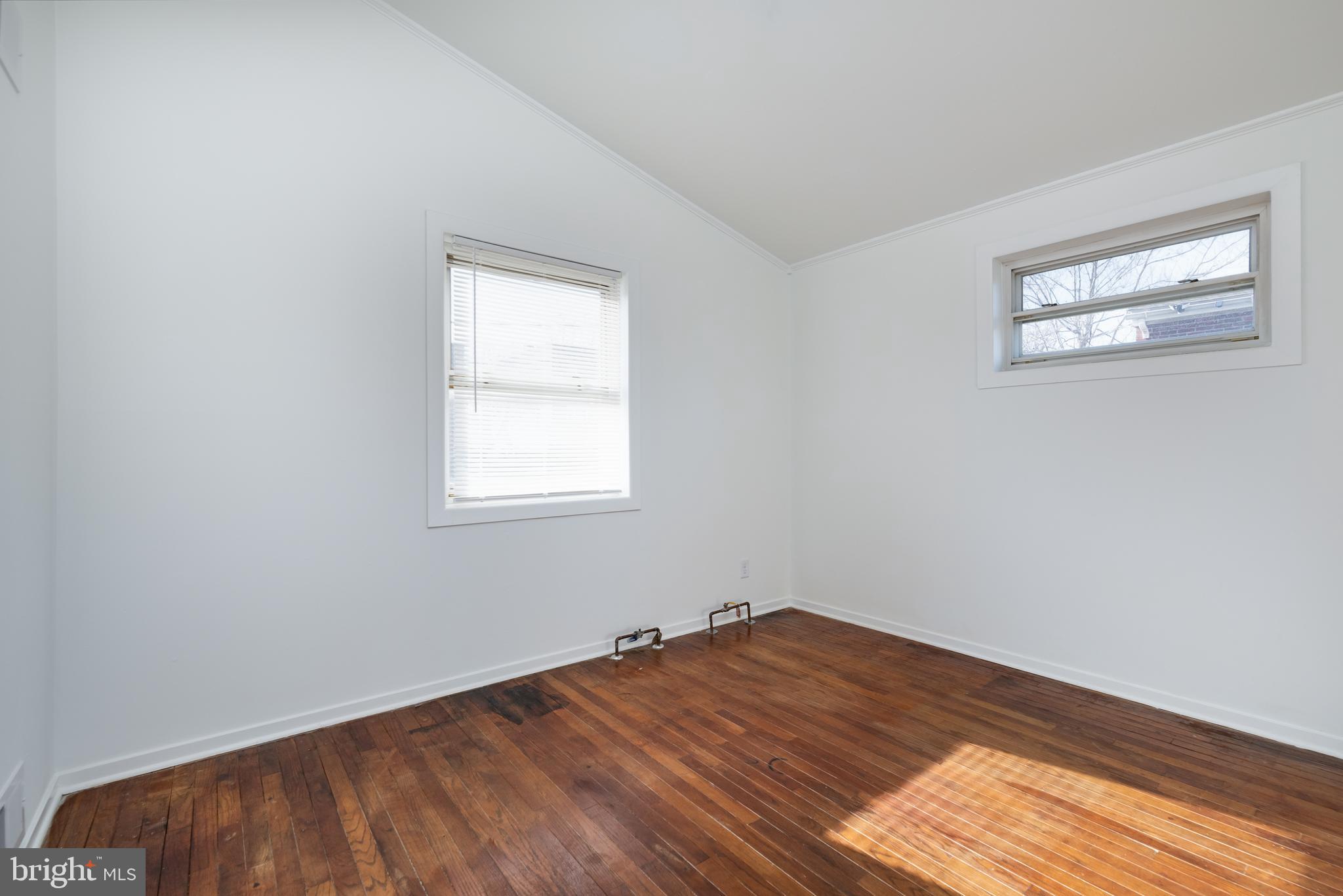 3005 Sollers Point Road Baltimore, MD 21222 - Photo 26 of 33 a view of a room with wooden floor and window