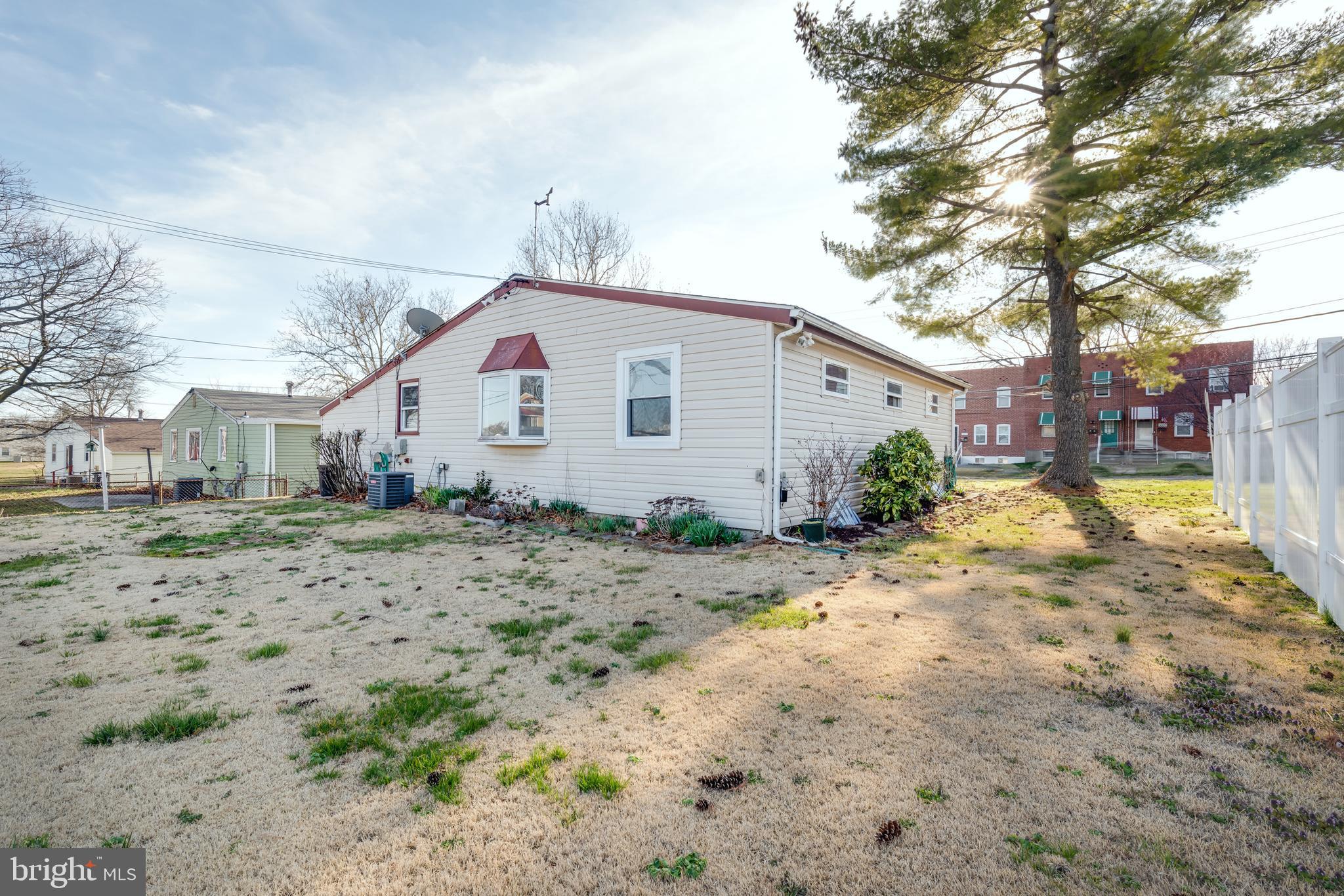 3005 Sollers Point Road Baltimore, MD 21222 - Photo 32 of 33 a view of a yard with a house