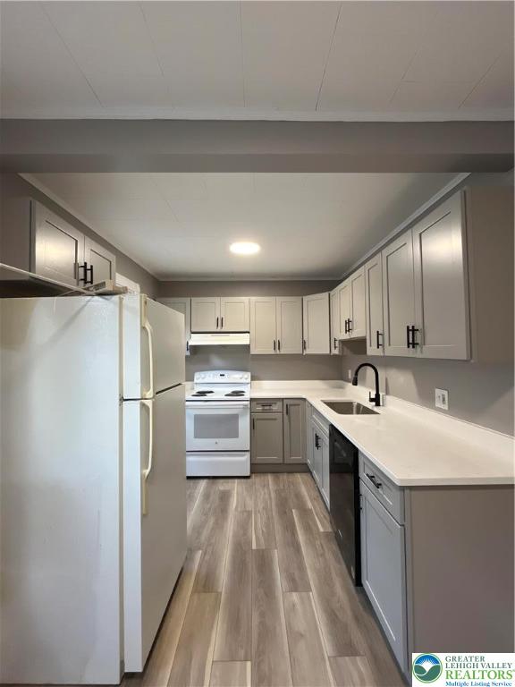 1222 Main Street, Unit 1 Northampton, PA 18067 - Photo 4 of 11 a kitchen with a sink refrigerator and cabinets