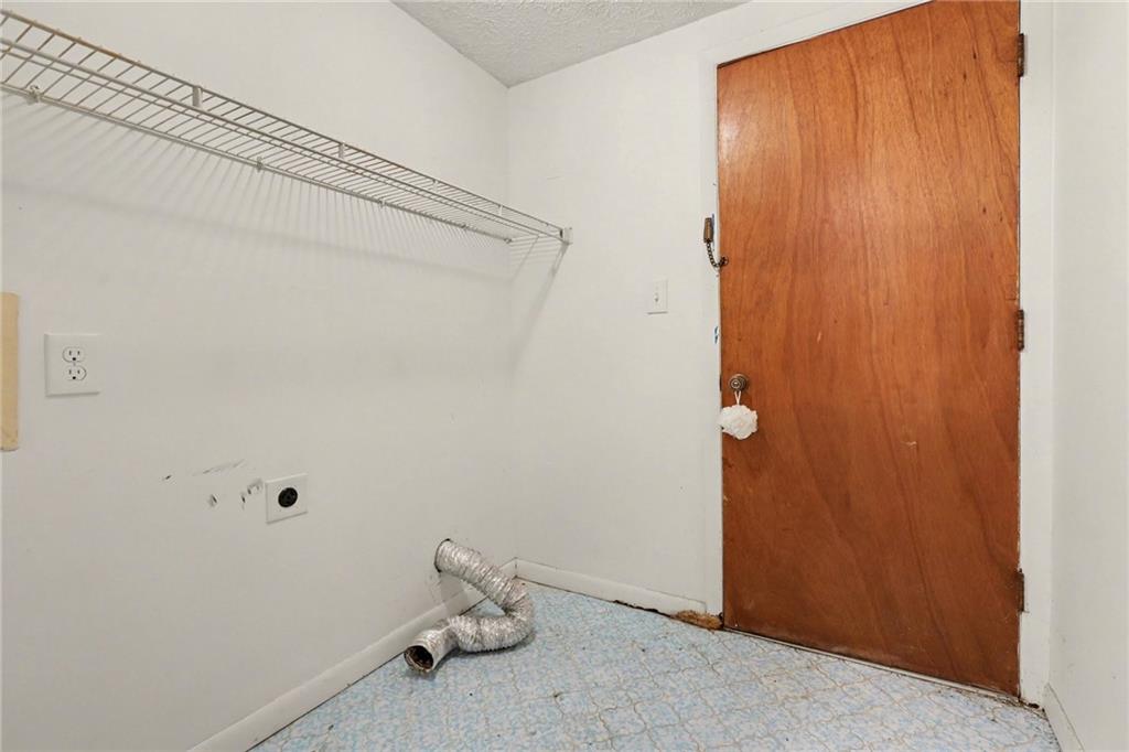 7019 Lake View Lane Doraville, GA 30360 - Photo 23 of 32 a view of a room with rack on the wall