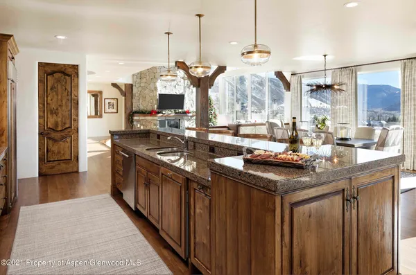 a kitchen with sink stove and refrigerator