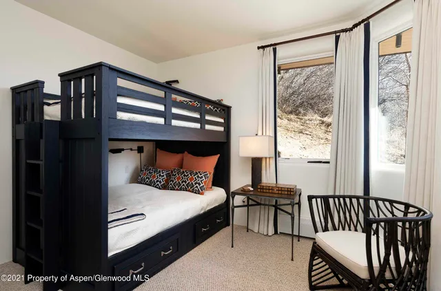 a bed room with a bed and a window