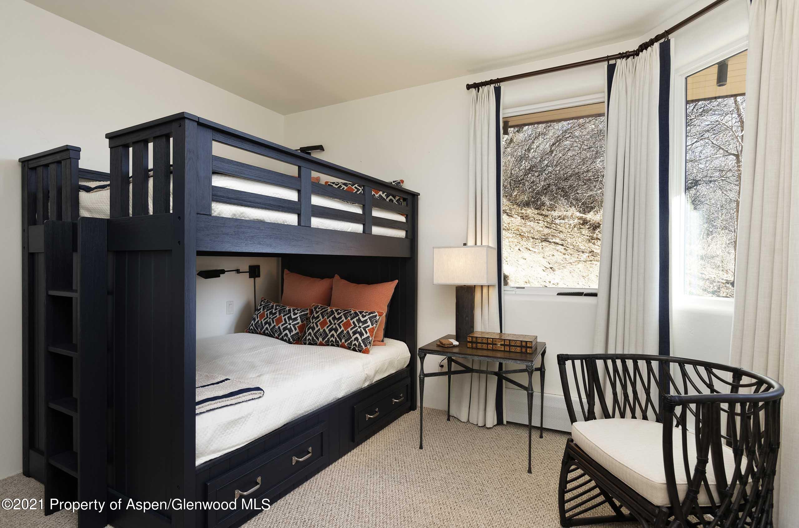 476 Wrights Road Aspen, CO 81612 - Photo 16 of 37 a bed room with a bed and a window