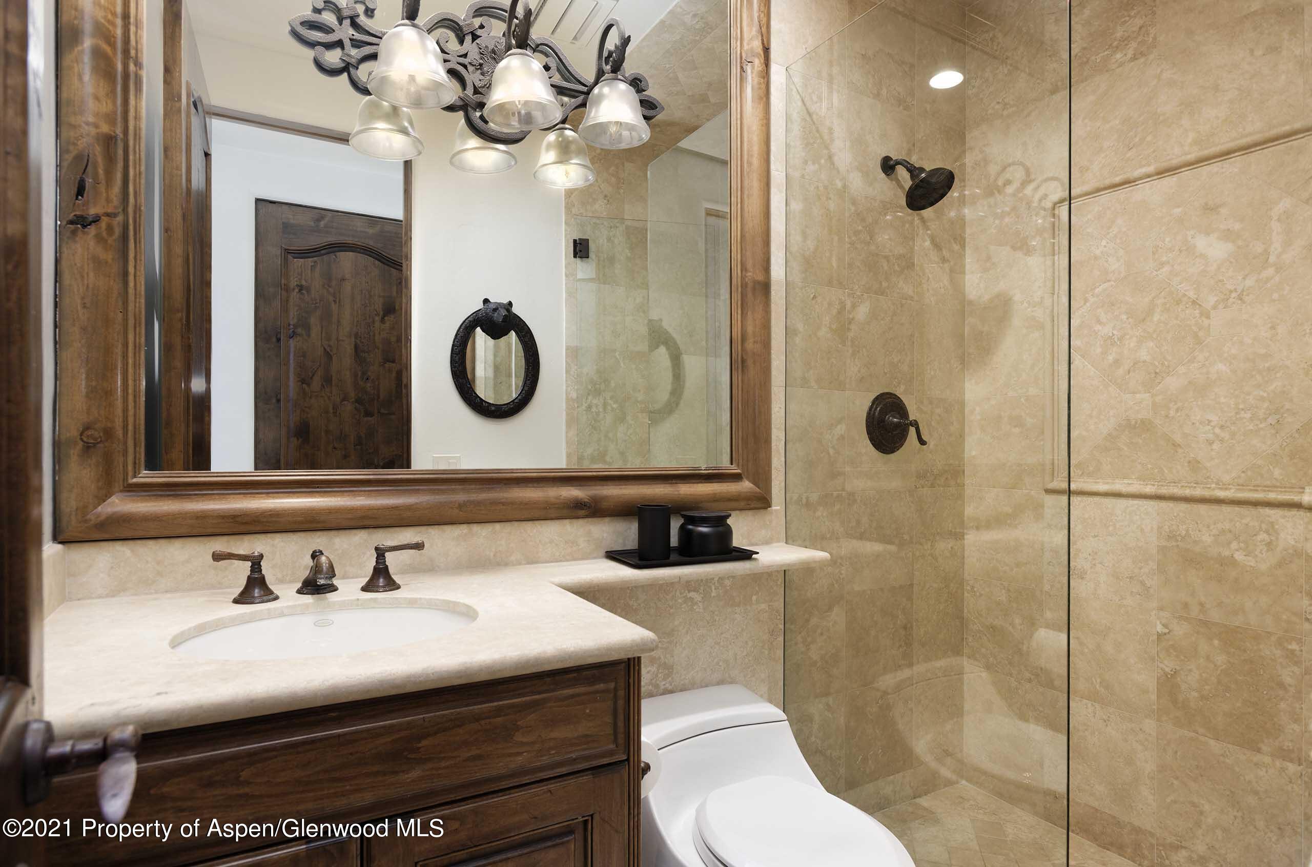 476 Wrights Road Aspen, CO 81612 - Photo 17 of 37 a bathroom with a sink a toilet and a mirror