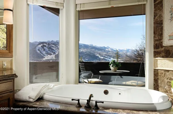 a living room with a large window and table