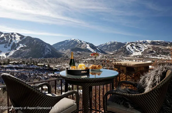 a view of a chairs and table in the patio