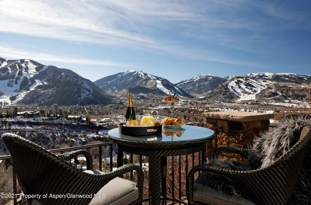 a view of a chairs and table in the patio
