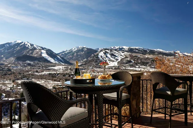 a view of balcony with furniture