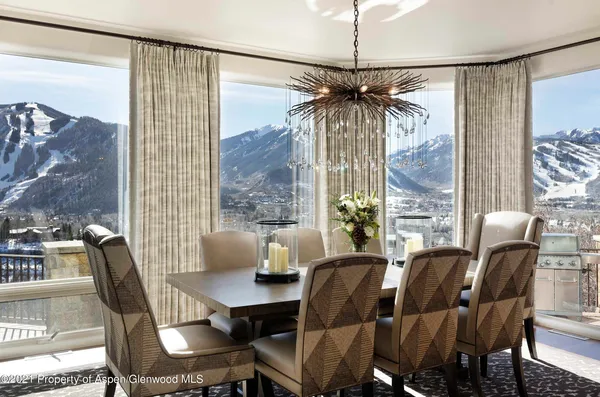 a dining room with furniture and window