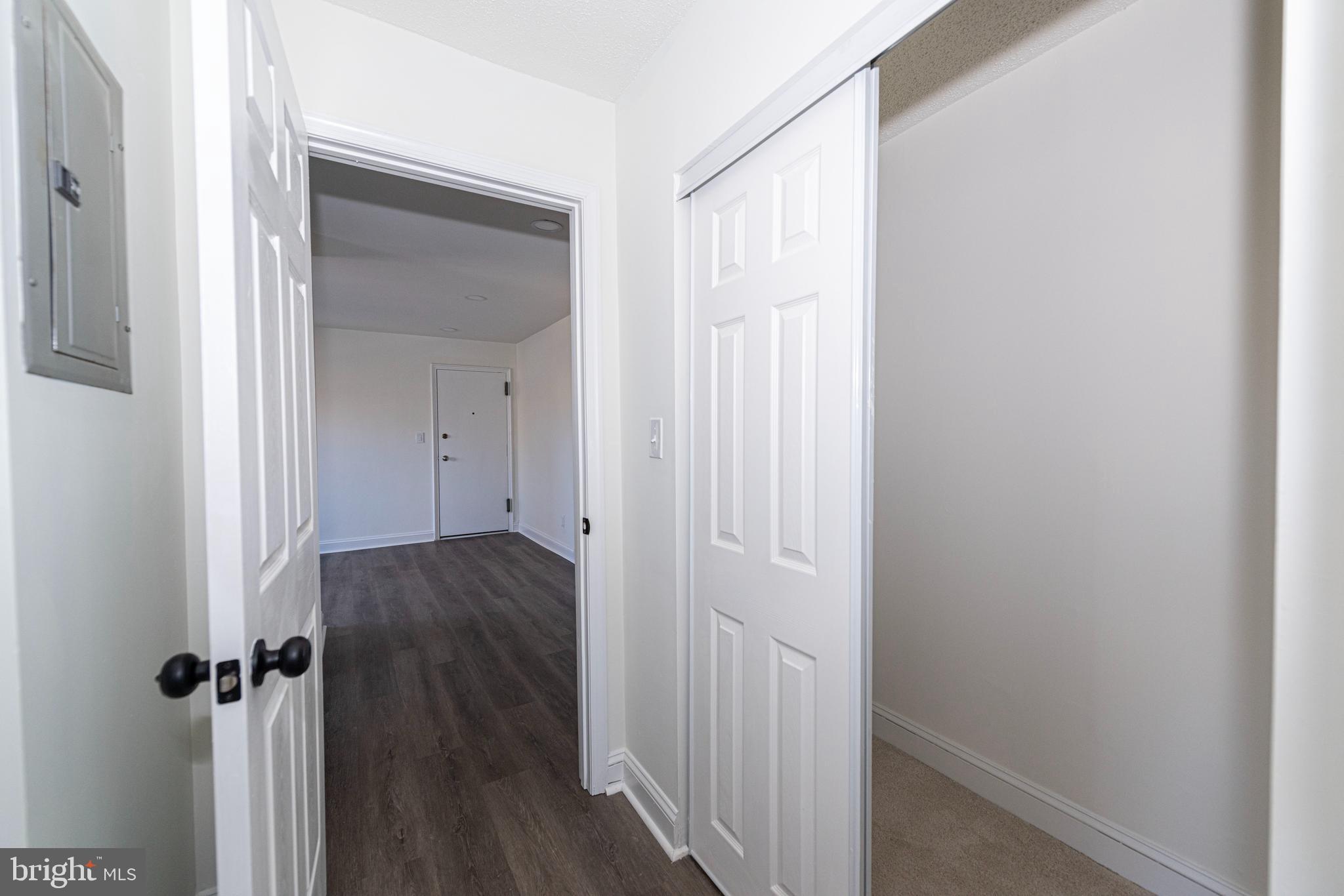 2237 Farrington Avenue, Unit 6204 Alexandria, VA 22303 - Photo 11 of 12 a view of a room with wooden floor and closet