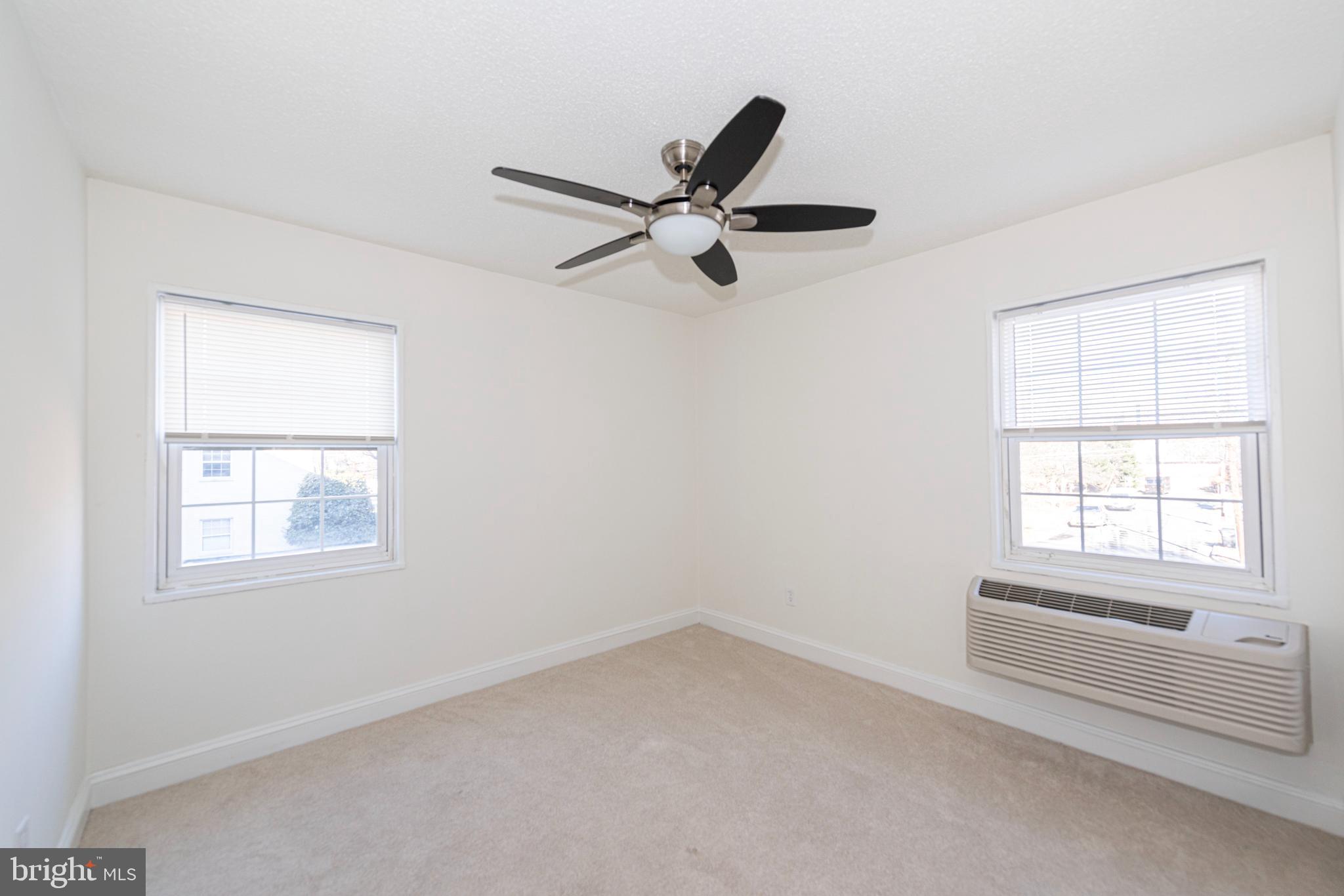 2237 Farrington Avenue, Unit 6204 Alexandria, VA 22303 - Photo 9 of 12 an empty room with windows and fan