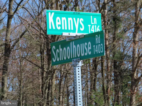 a view of a sign board with a big yard