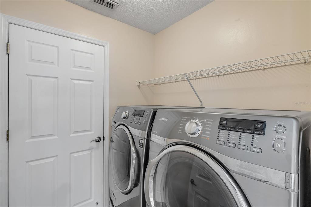 12232 Bronson Way Orlando, FL 32824 - Photo 20 of 32 a utility room with dryer and washer