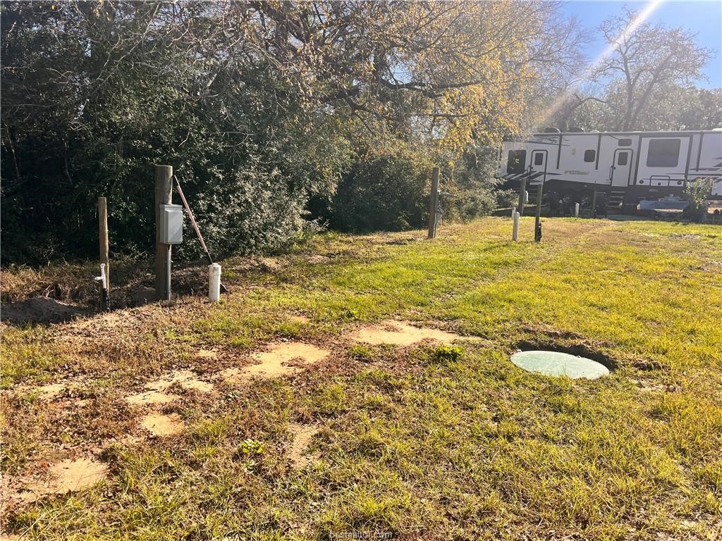 6966 Highway 7 Jewett, TX 75846 - Photo 16 of 18 a swimming pool with outdoor seating and yard