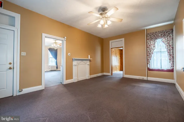 a kitchen with granite countertop a sink cabinets and window