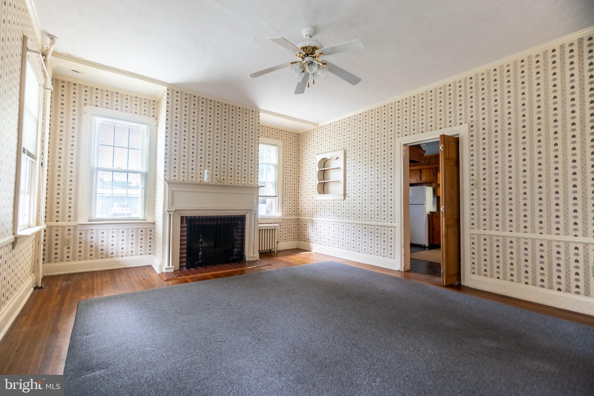249 York Street Hanover, PA 17331 - Photo 19 of 42 a view of a livingroom with a fireplace and window